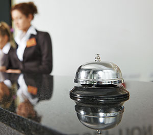 The bell on a hotel front desk